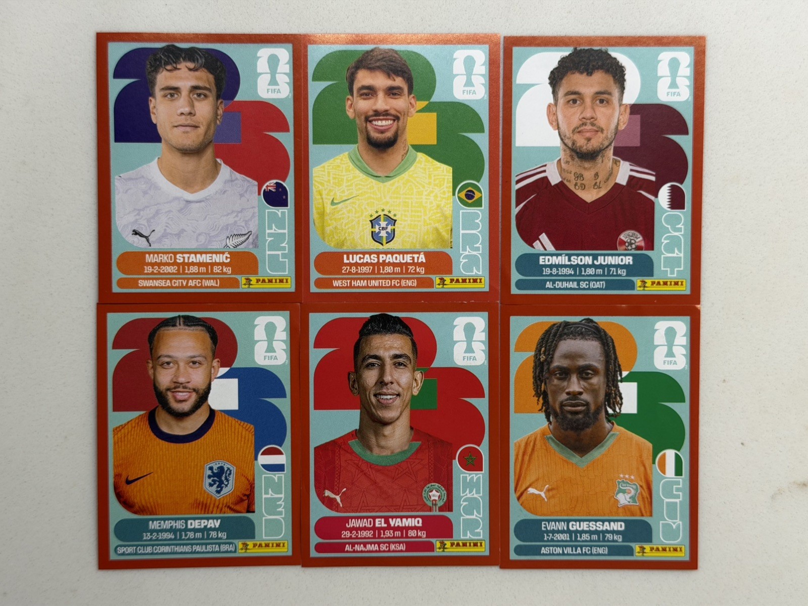 (6) Panini FIFA WC ‘26 BRA 9, NED 17, MAR 8, QAT 17, CIV 18, NZL 15 Red Stickers