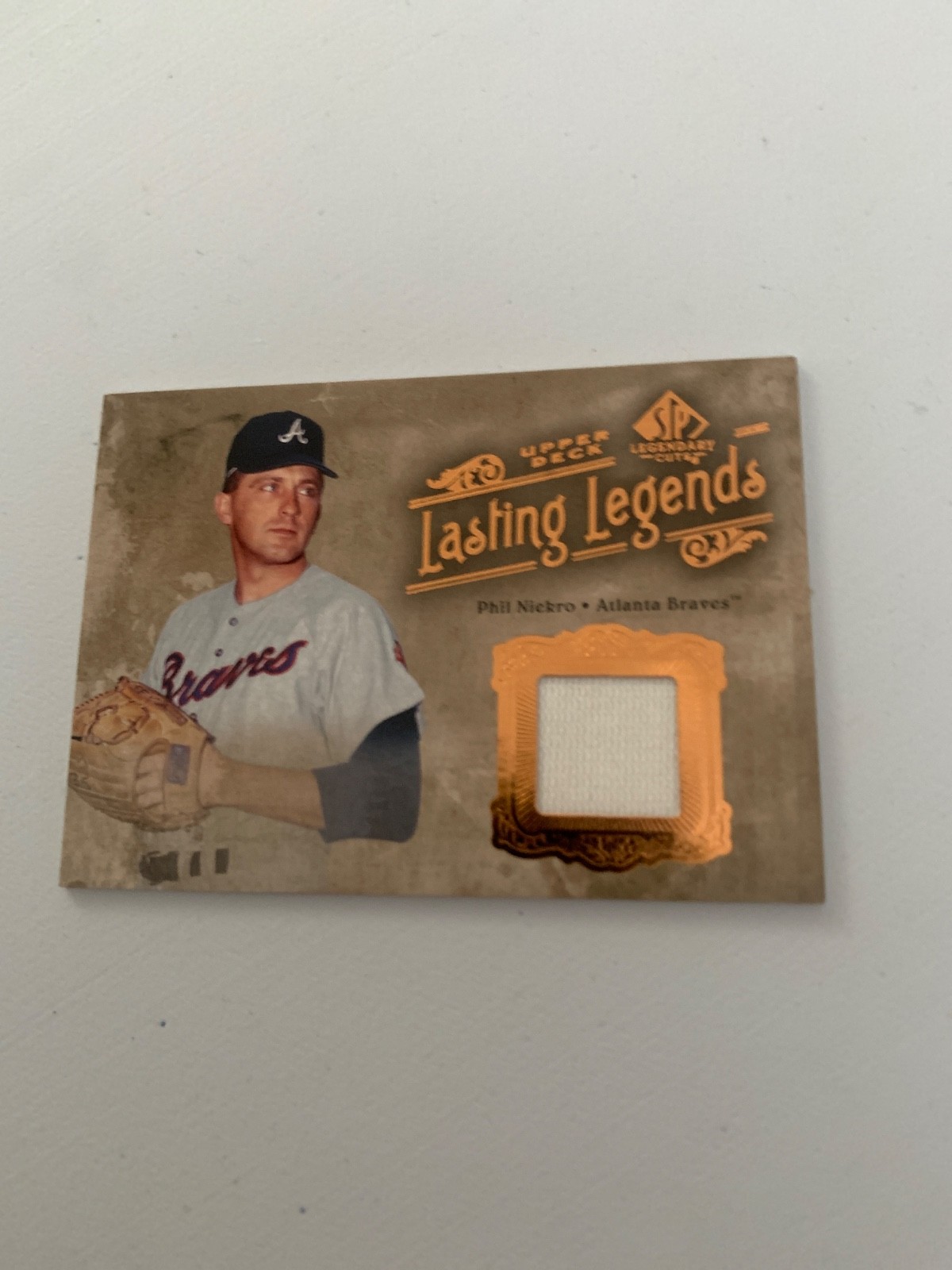 2005 SP Legendary Cuts #LL-PN Phil Niekro Lasting Legends Material
