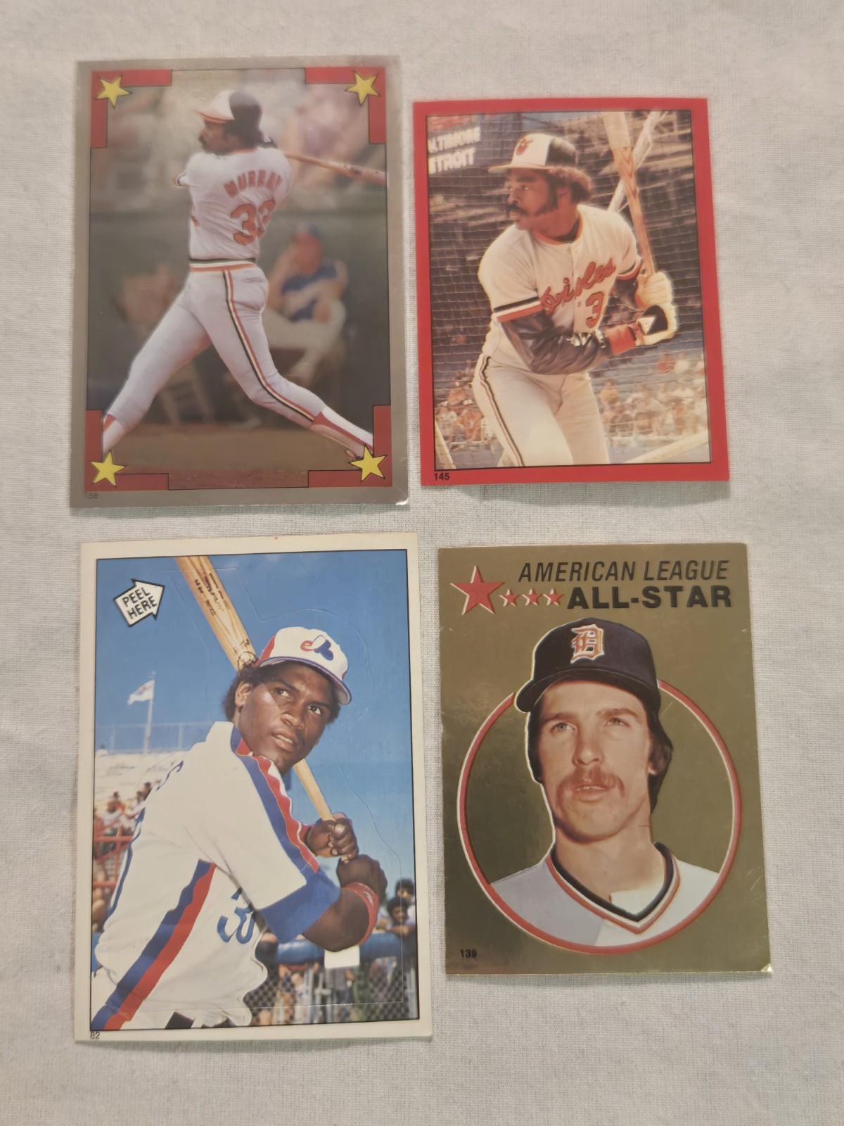 Lot of 4: 1982 85 86 Topps Stickers- (2) Eddie Murray, Tim Raines, J. Morris HOF