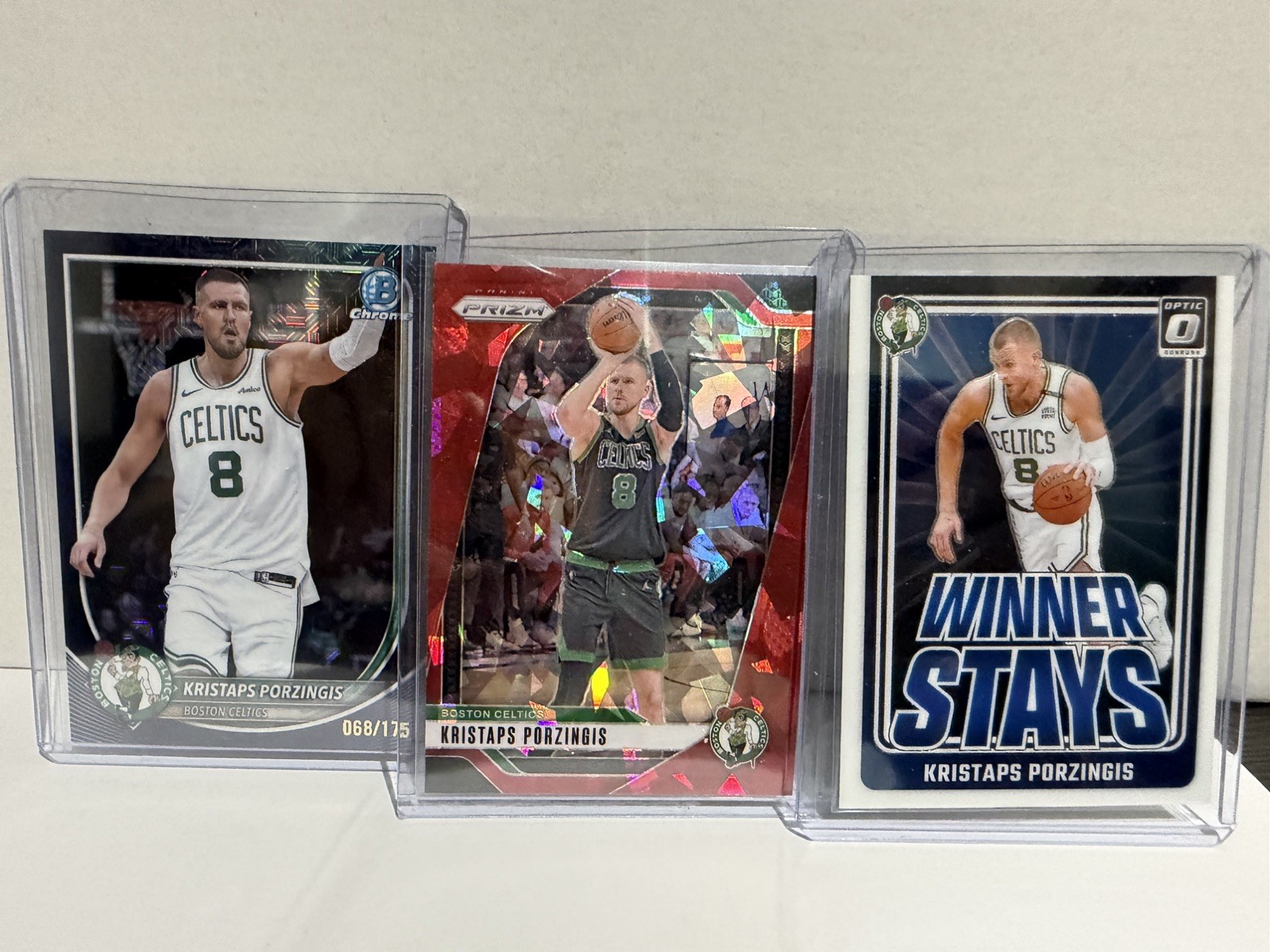 Kristaps Porzingis 3 card lot ,Navy Mojo #/175, Prizm red ice, winner stays