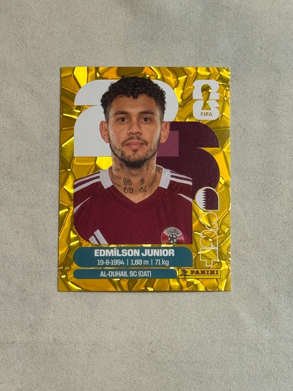 2026 Panini FIFA World Cup Sticker Gold Flood Crumple Edmilson Junior #QAT17