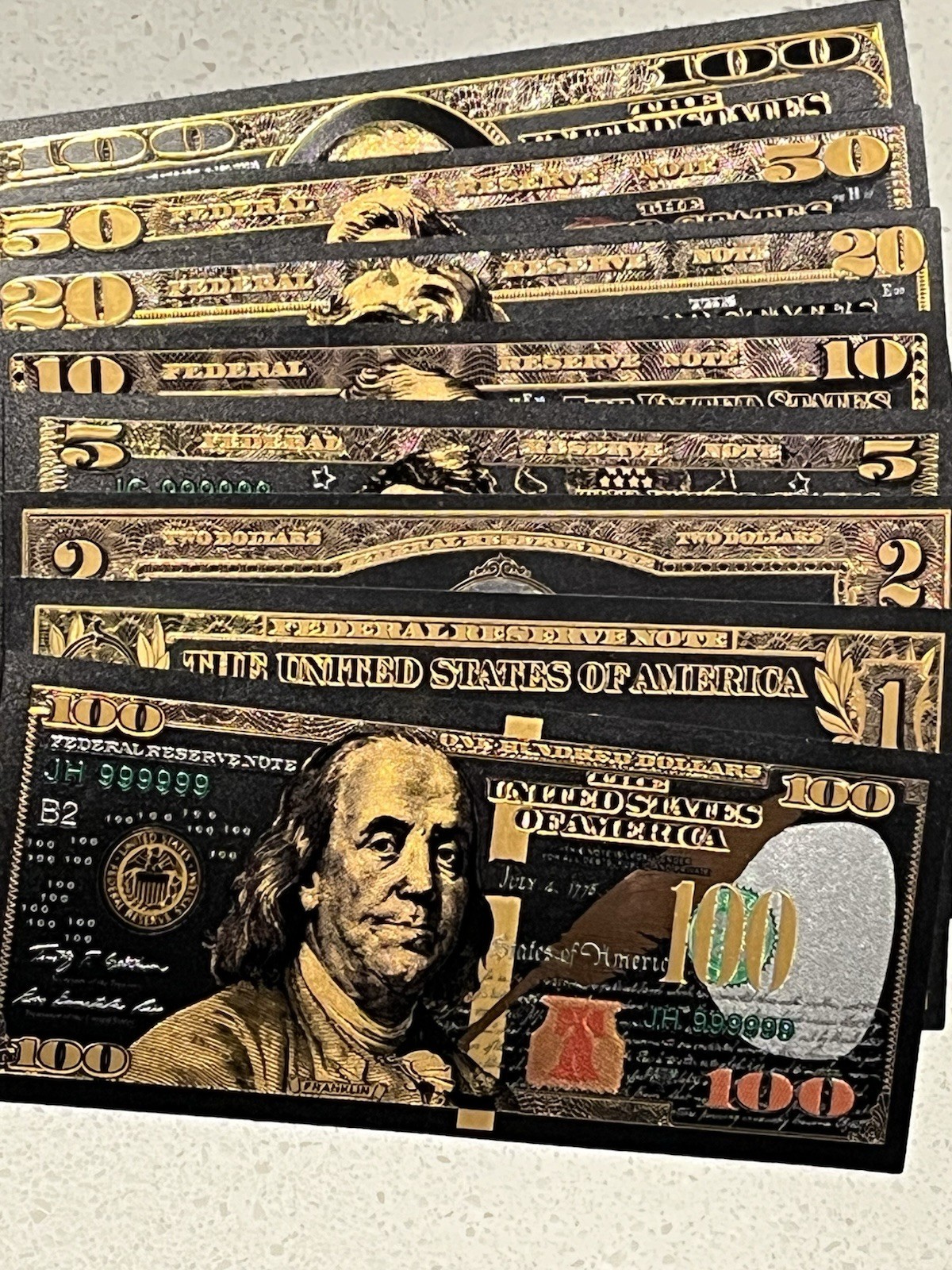 Glittering Black Gold Foil Banknotes. Comes In Top Loader Sleeves. Lot Of 7 Pcs.