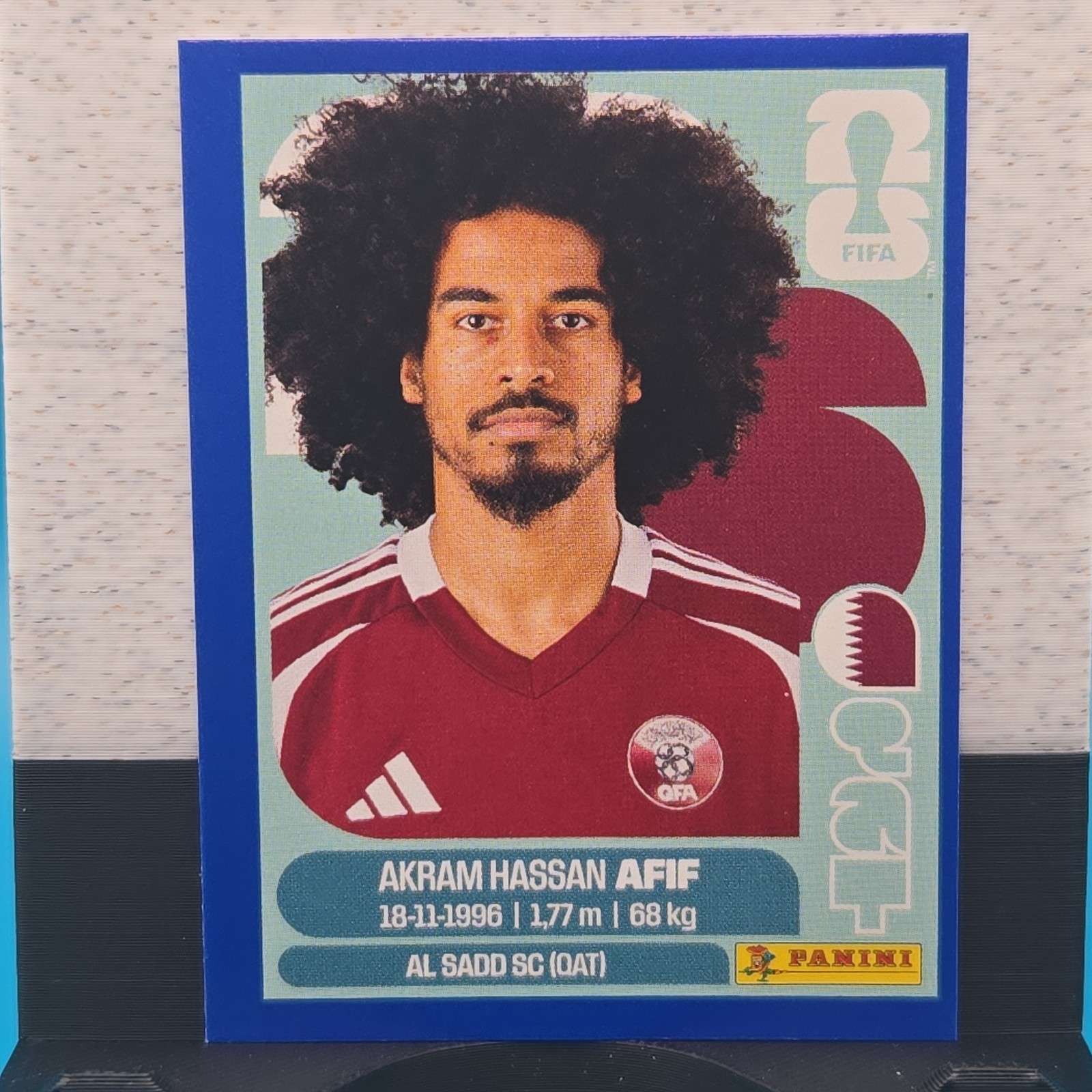 Panini FIFA World Cup BLUE PARALLEL STICKER AKRAM HASSAN AFIF