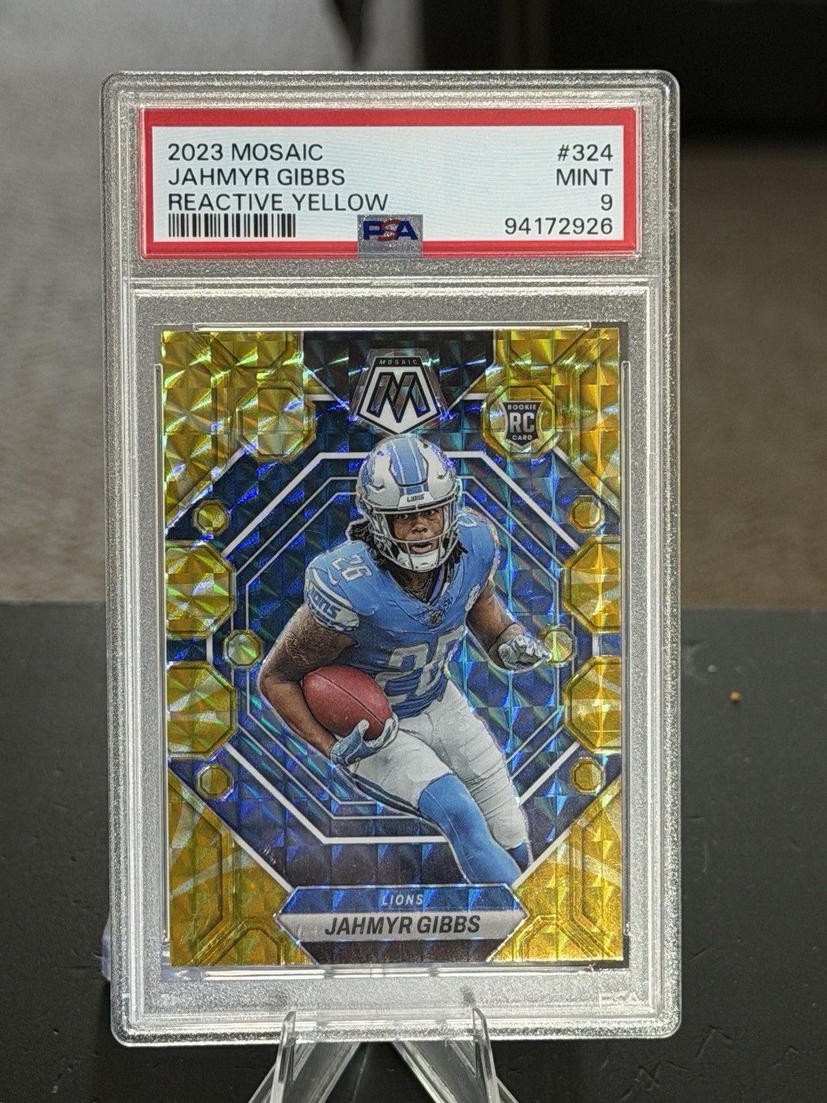 2023 Panini Mosaic – Rookies Jahmyr Gibbs #324 Reactive Yellow Mosaic Prizm (RC)
