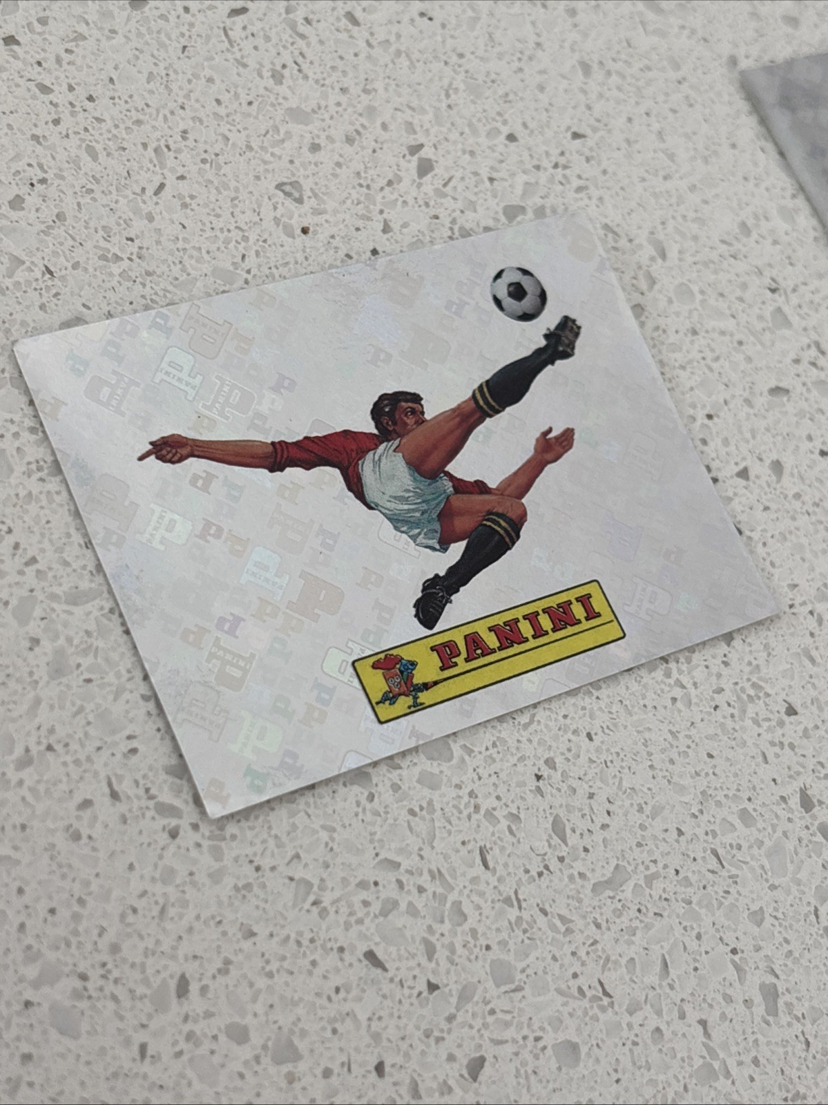 2026 Panini FIFA World Cup Sticker 00 Panini Logo FOIL FWC00