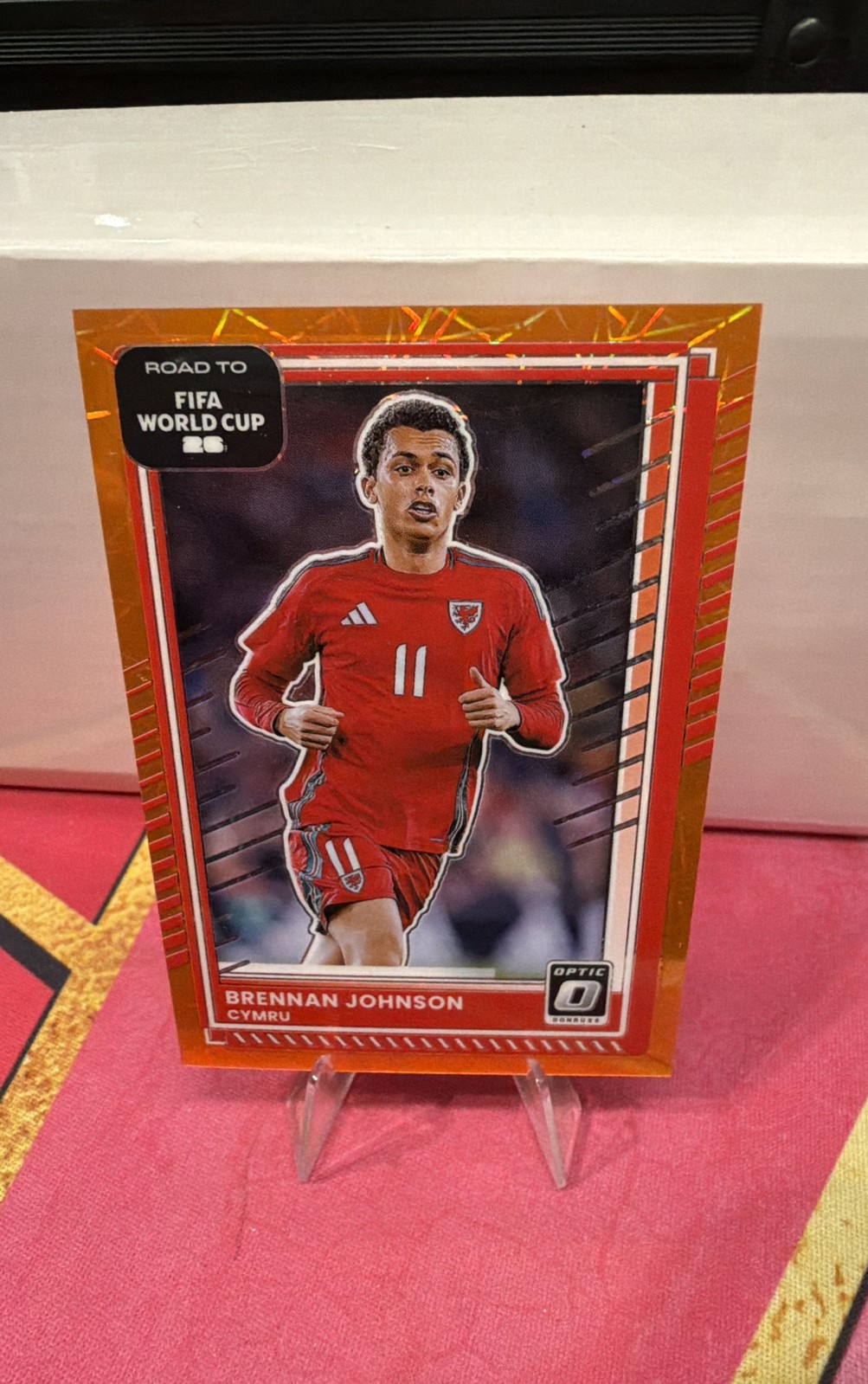 2025-26 Panini Donross Optic Brennan Johnson #1 Orange Laser CYMRU /199