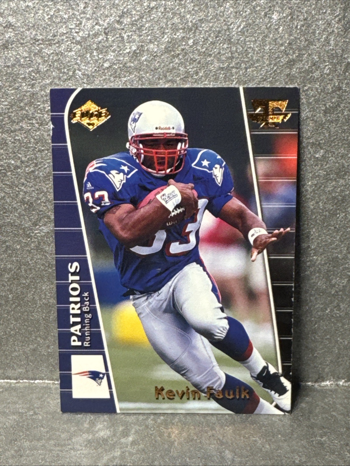 1999 Collector’s Edge Triumph – Kevin Faulk #T155 (RC)