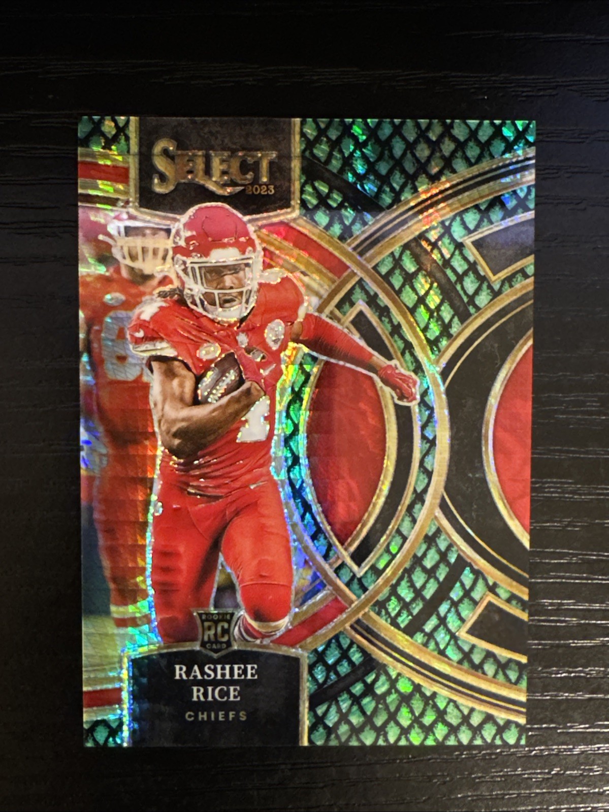 2023 Panini Select – Premier Level Rashee Rice #132 Dragon Scale Prizm /70 (RC)