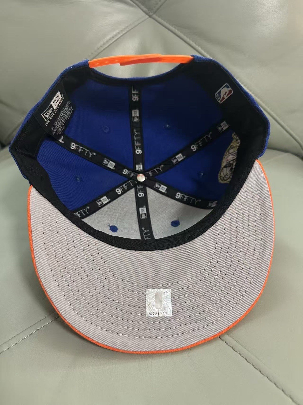New York Knicks 2026 NBA Champions New Era 9FIFTY Snapback Cap Blue & Orange