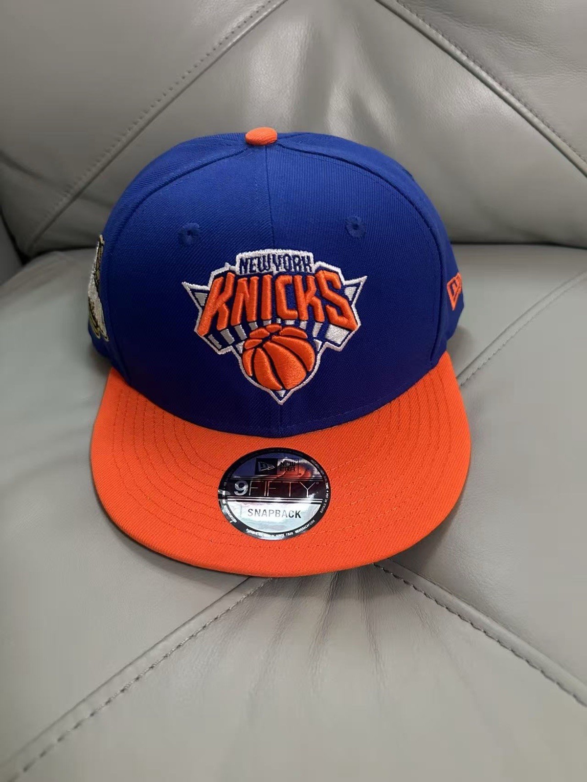 New York Knicks 2026 NBA Champions New Era 9FIFTY Snapback Cap Blue & Orange