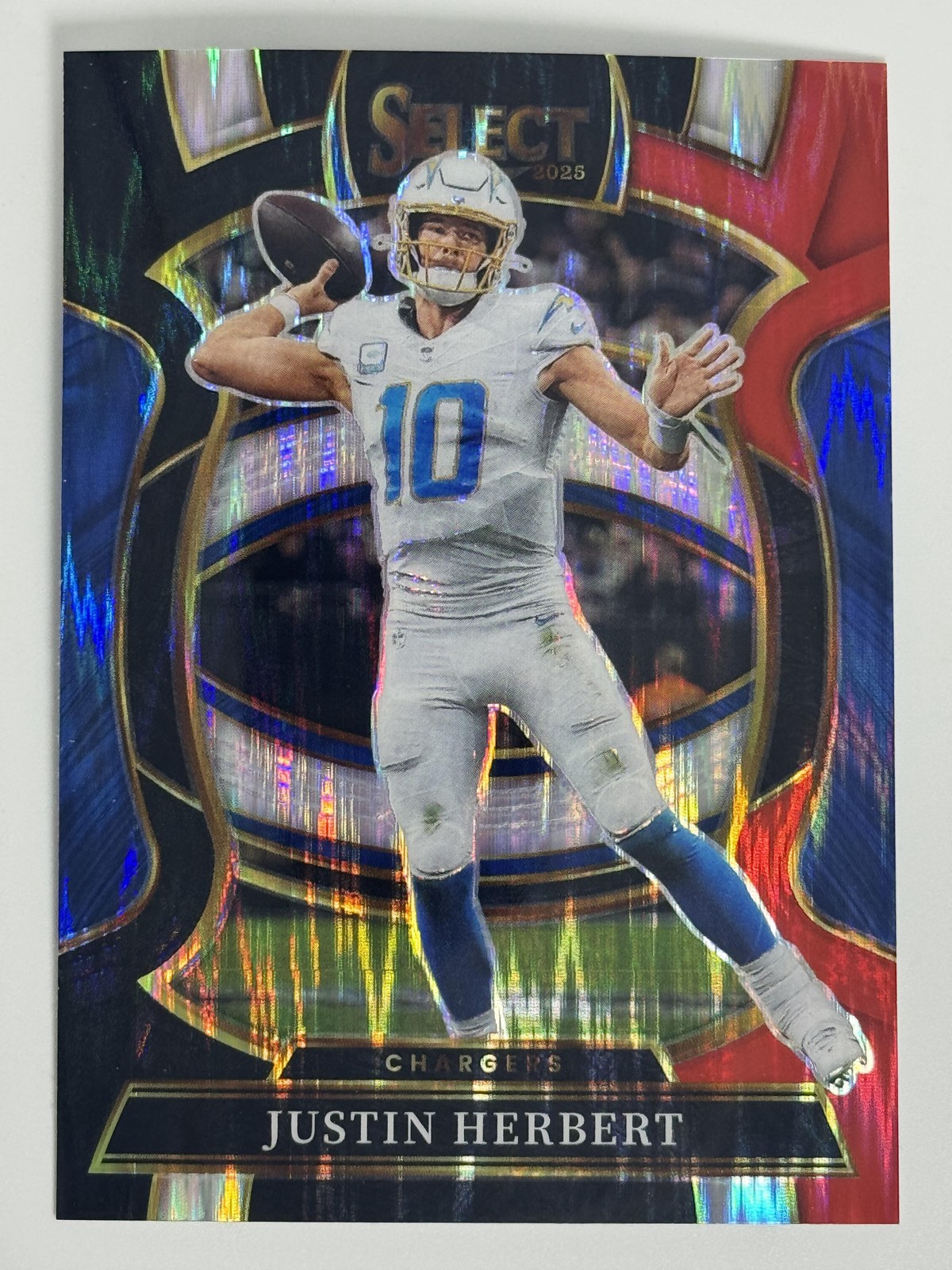 2025 Panini Select Black and Red Prizm Shock #1 Justin Herbert Chargers