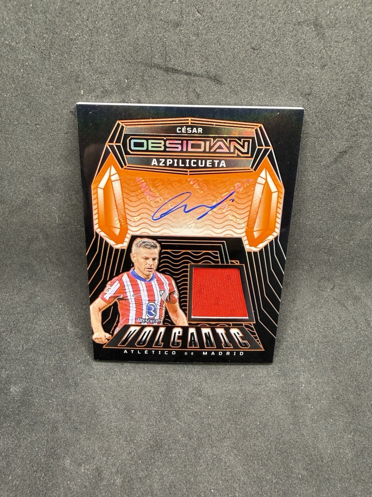 Cesar Azpilicueta 2024-25 Panini Obsidian Volcanic Patch Auto Orange /149