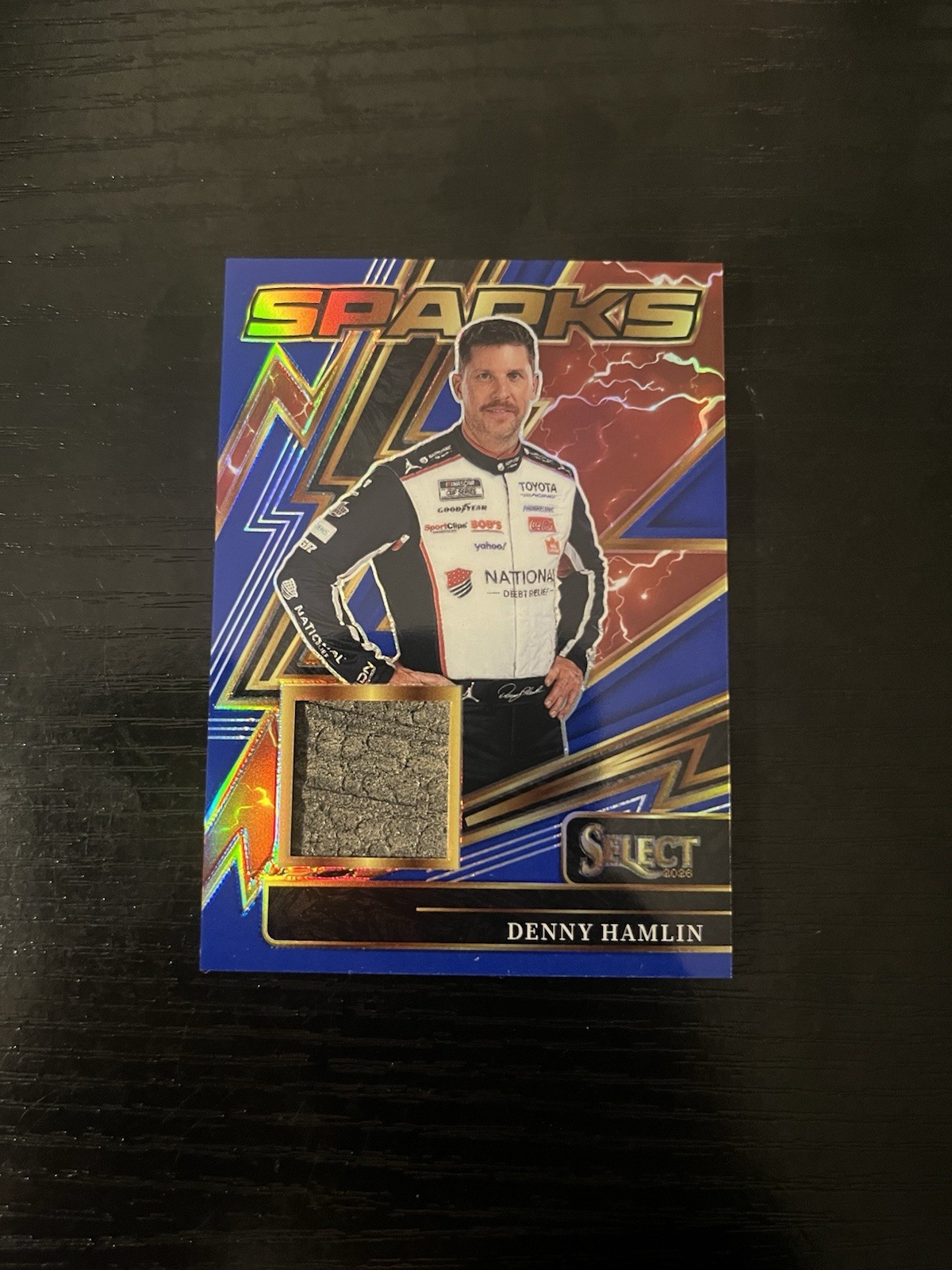 Denny Hamlin 2026 Panini Select Sparks Blue Race-Used Mem 48/49 National Debt