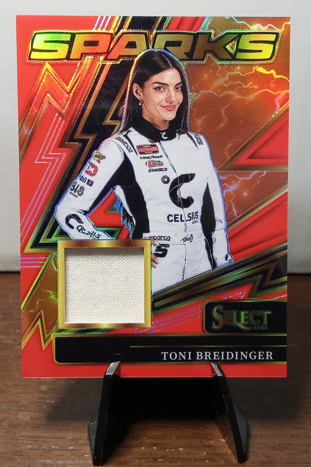 2026 Panini Select – Toni Breidinger 68/99 – Red Prizm Sparks – Material #SP-TBR