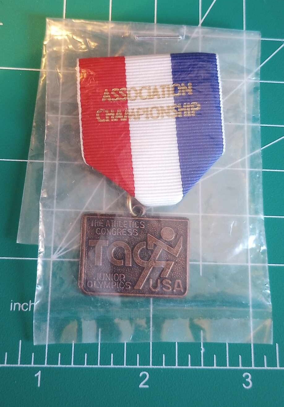 The Athletics Congress Junior Olympics USA Association Championship Medal